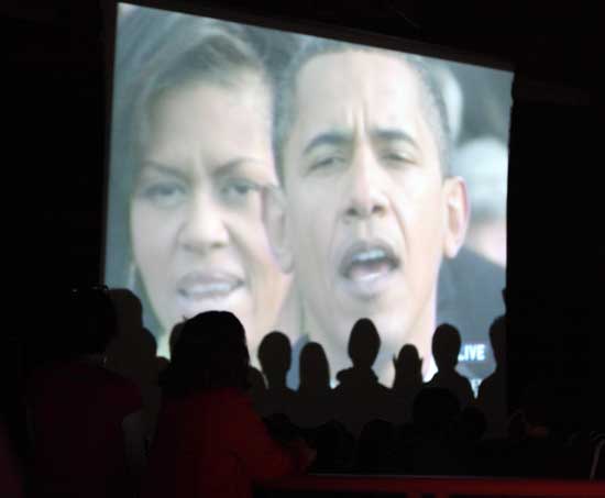 Bromfield students rise and sing the National Anthem in the Cronin Auditorium where many watched the historic inauguration of Barack Obama, the nation’s first president of African descent.