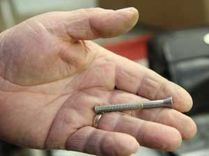 One of the hardest items to track down was sleigh bolts. This one was found in Ken Harrod’s barn. Sleigh bolts are unusual in that they are smooth on the top and come with square nuts. (Photo by Lisa Aciukewicz)