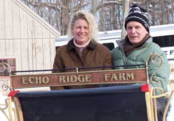 Bruce Perkins sits with daughter Kelly in the restored sleigh on delivery day. (Courtesy photo)