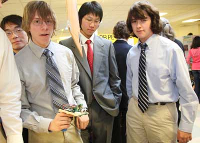 Shunan Zhao, Benjamin Waldman, David Choi, and Mac Devlin, members of the Inventeam, show off their prize-winning electronic cane.
