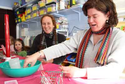 Not just for kids! Moms Rebecca Waugh and Suzanne Hays make cards at a Valentine-making open house at the Barn School.