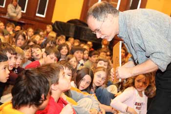Will Thompson speaks with Wicked author Gregory Maguire at a presentation he gave in Volunteers Hall of the library for third- and fourth-graders from the elementary school. (Photo by Lisa Aciukewicz)