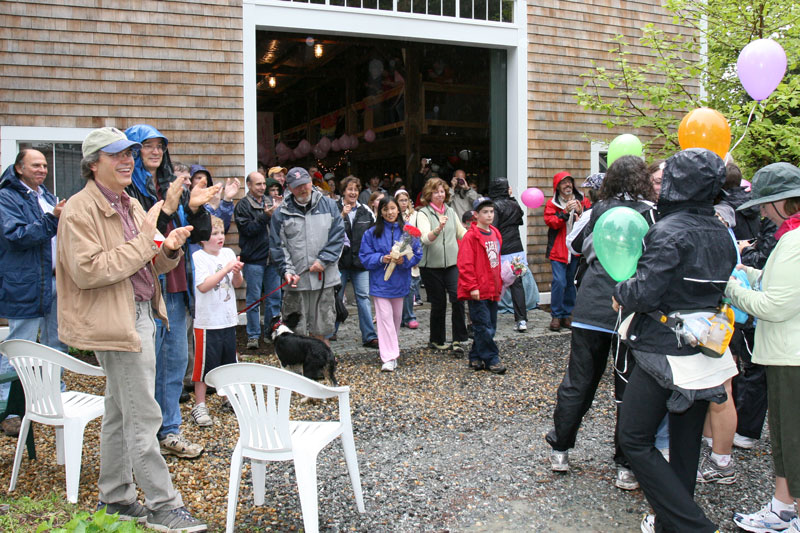 Family and friends welcome the Just ’Cause walkers home at a party at the Macrae-Broadbent barn on Oak Hill Road. (Photo by Pat Westwater-Jong)