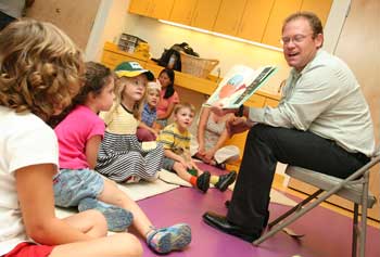 Dennis O’Connor, a district manager at Waste Management, reads I Stink, a book about garbage, to children at the library at an event earlier this fall. (Photo by Lisa Aciukewicz) Dennis O’Connor, a district manager at Waste Management, reads I Stink, a book about garbage, to children at the library at an event earlier this fall. (Photo by Lisa Aciukewicz)